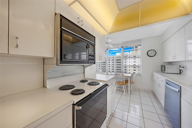 kitchen with white cabinetry, ceiling fan, white appliances, and light tile patterned floors