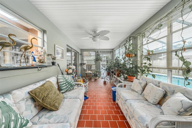 sunroom with plenty of natural light and ceiling fan