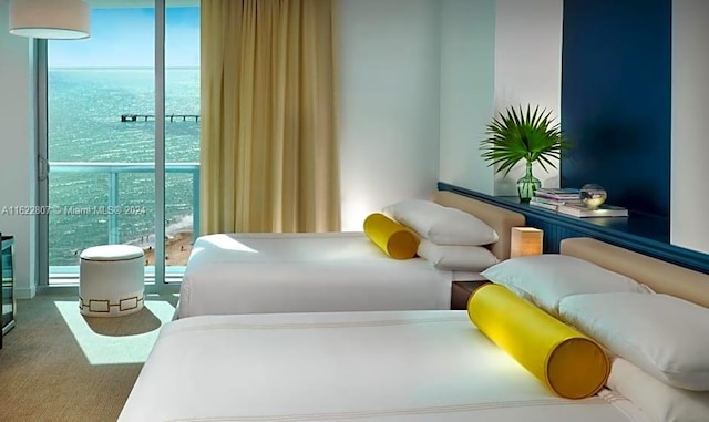 carpeted bedroom featuring a water view