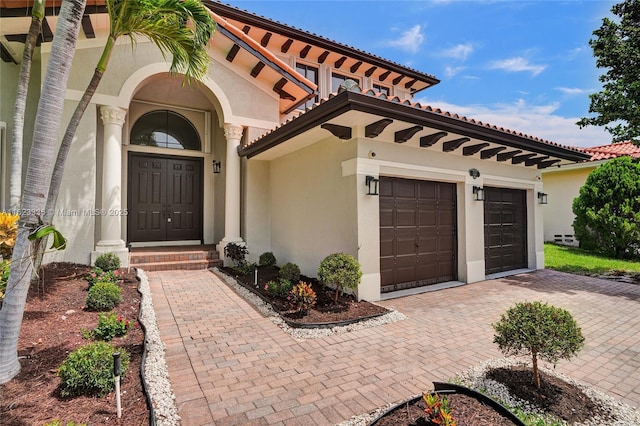 view of front of property with a garage