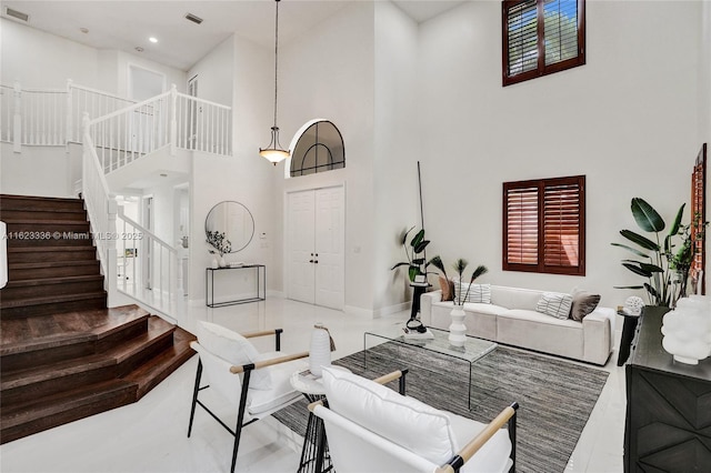 living room with a towering ceiling