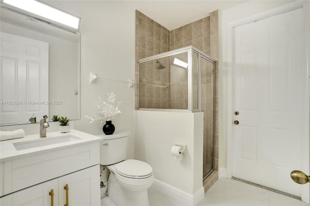 bathroom with vanity, an enclosed shower, and toilet