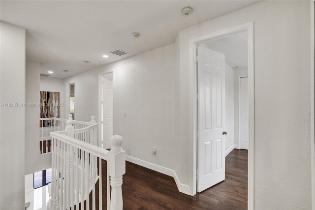 hall featuring dark wood-type flooring