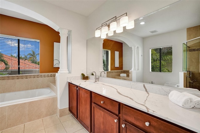 full bathroom with plus walk in shower, decorative columns, vanity, toilet, and tile patterned floors