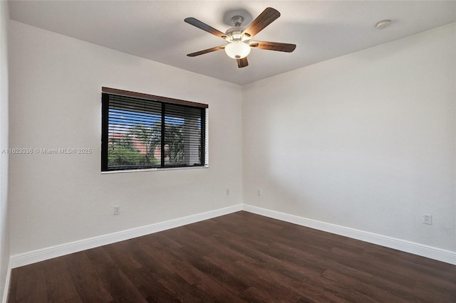 unfurnished room featuring dark wood-type flooring and ceiling fan