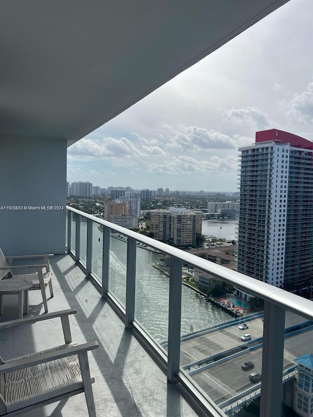 balcony featuring a water view