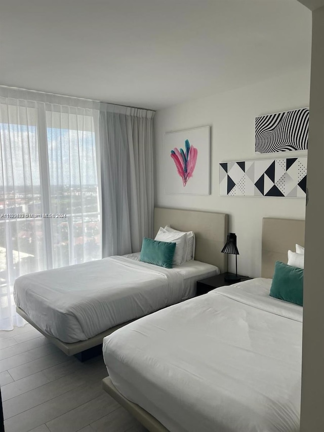 bedroom with wood-type flooring