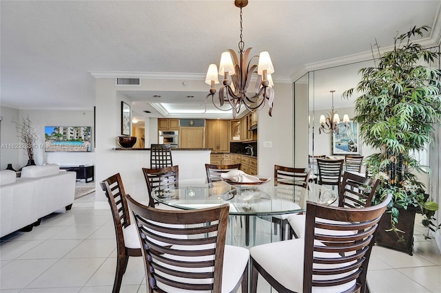 tiled dining space featuring a chandelier, a raised ceiling, and ornamental molding