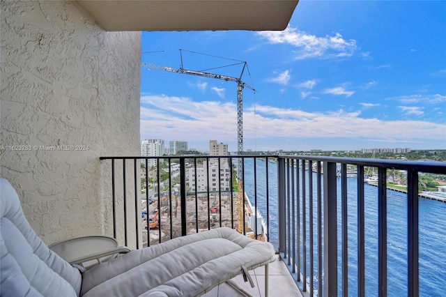 balcony featuring a water view