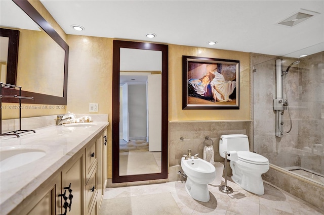 bathroom featuring a shower with shower door, a bidet, tile patterned flooring, and double sink vanity