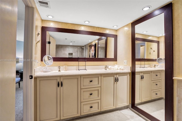 bathroom with tile patterned flooring and double sink vanity