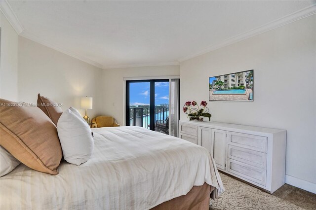 carpeted bedroom featuring access to outside and ornamental molding