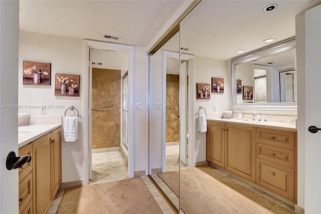 bathroom with walk in shower and vanity