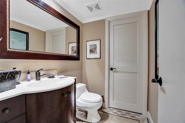 bathroom featuring tile patterned flooring, toilet, and vanity