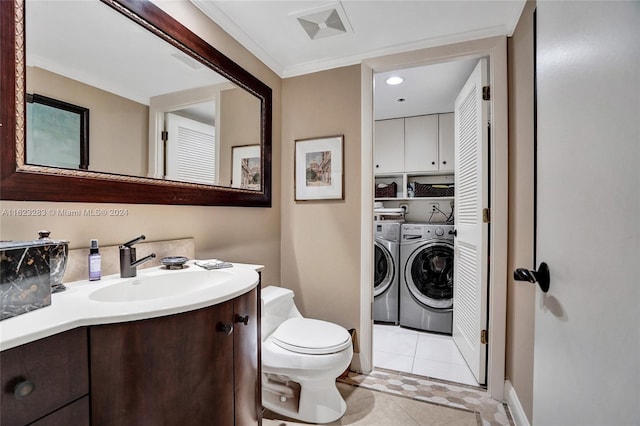 bathroom featuring vanity, separate washer and dryer, toilet, and tile patterned floors