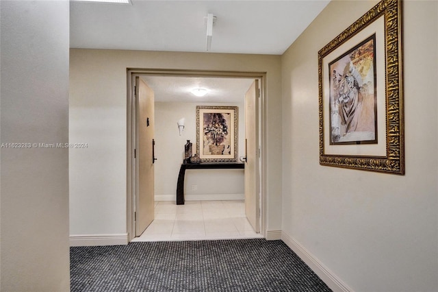 hallway featuring tile patterned flooring