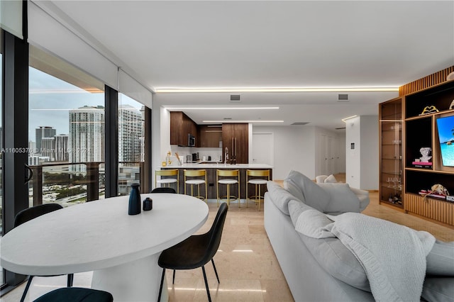 dining room featuring sink and a wealth of natural light