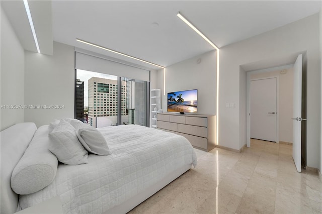 bedroom featuring light tile patterned flooring