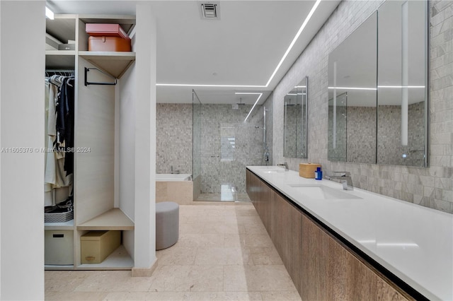 bathroom with vanity, shower with separate bathtub, and tile patterned flooring