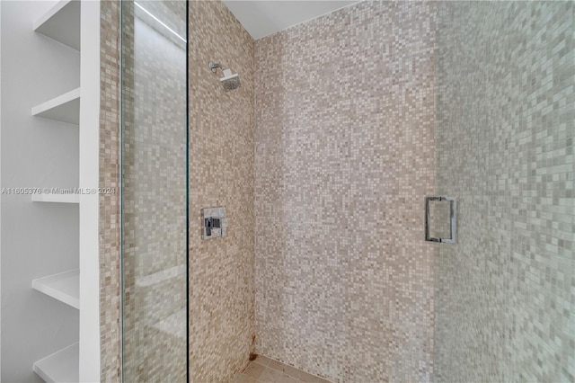 bathroom with tiled shower