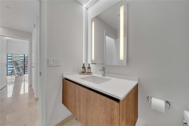 bathroom with tile patterned flooring and vanity