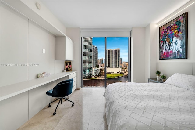 bedroom with access to outside and light tile patterned floors