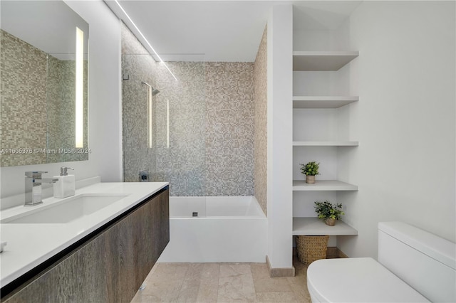 bathroom with tile patterned flooring, toilet, and vanity