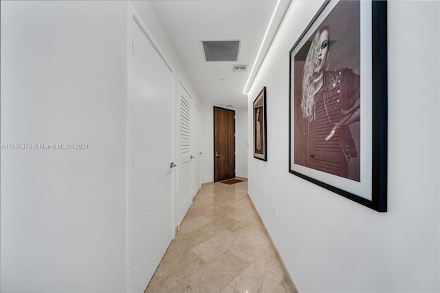 hallway with light tile patterned floors