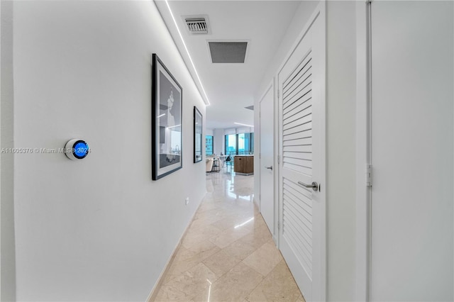 hallway with light tile patterned floors