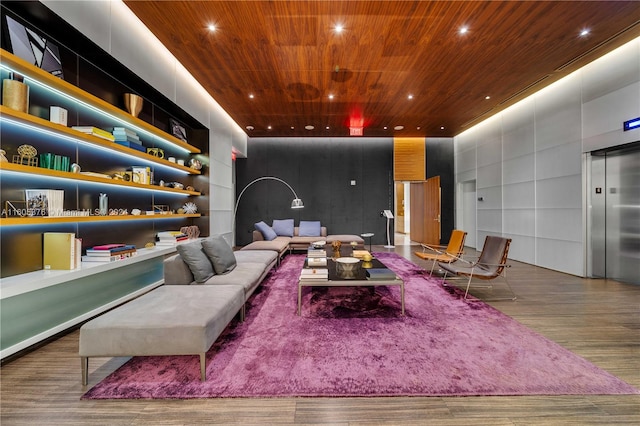 interior space with wood-type flooring, elevator, and wooden ceiling