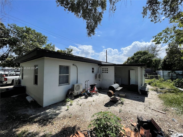 back of house featuring ac unit