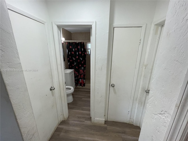 hall with dark hardwood / wood-style floors