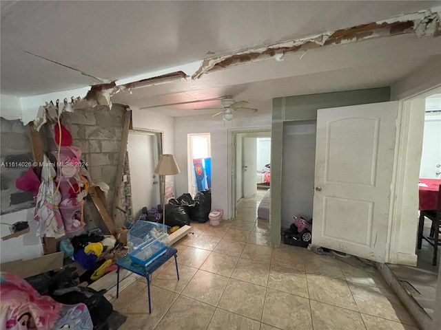 miscellaneous room featuring ceiling fan and light tile patterned floors