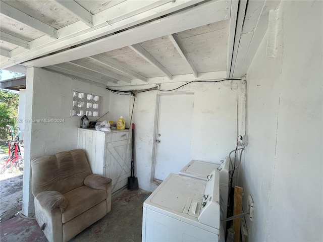 clothes washing area with washing machine and clothes dryer