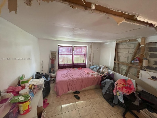 bedroom with light tile patterned floors