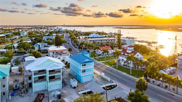 aerial view at dusk with a water view