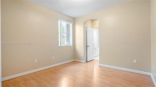 unfurnished room with light hardwood / wood-style flooring