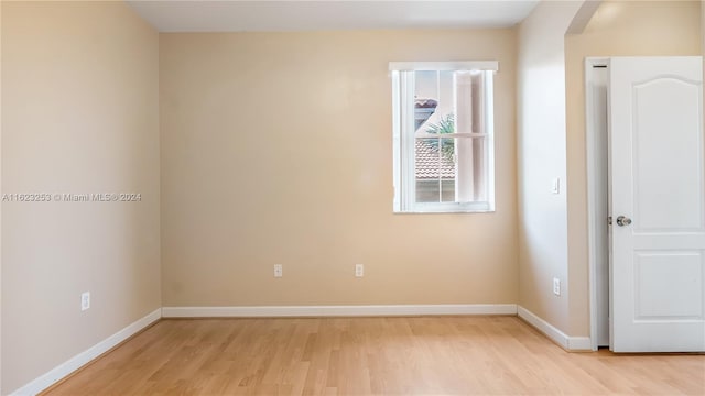 unfurnished room with light hardwood / wood-style floors