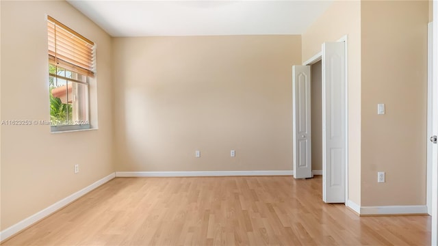 spare room featuring light wood-type flooring