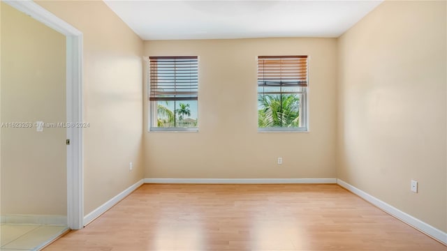 unfurnished room featuring light hardwood / wood-style floors