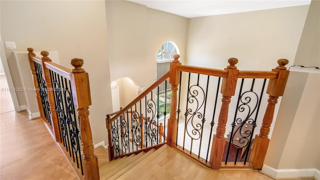 staircase featuring light wood-type flooring