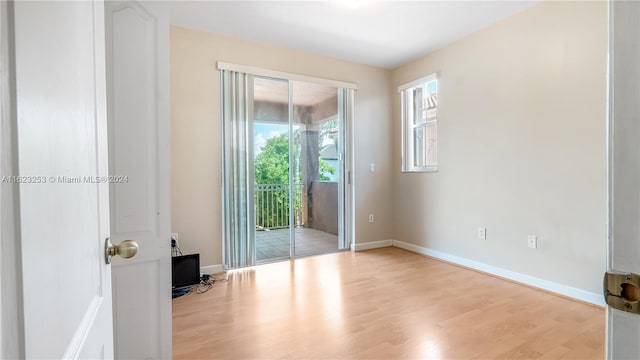 spare room with light hardwood / wood-style floors