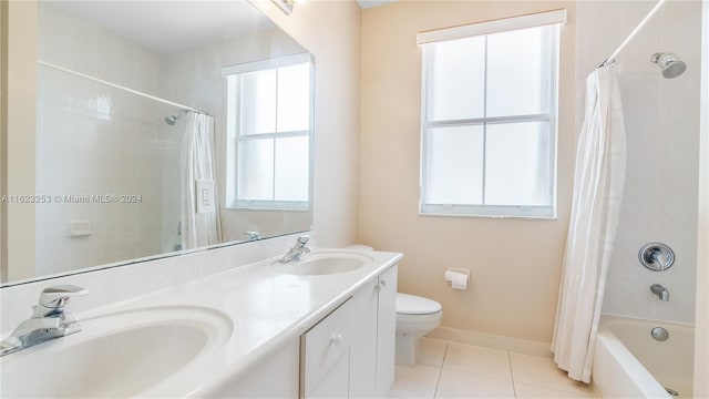 full bathroom with tile patterned floors, shower / tub combo with curtain, double vanity, and toilet