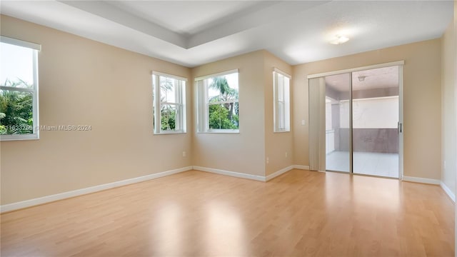 unfurnished room featuring light hardwood / wood-style flooring