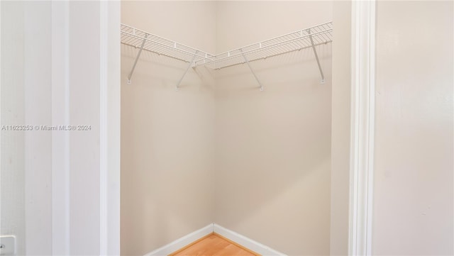 spacious closet featuring hardwood / wood-style flooring