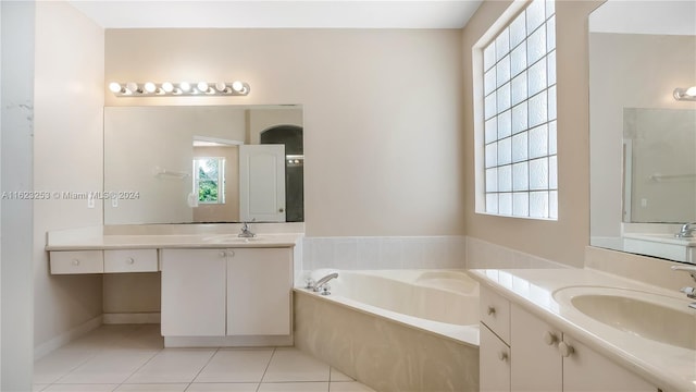 bathroom with separate shower and tub, tile patterned flooring, and vanity