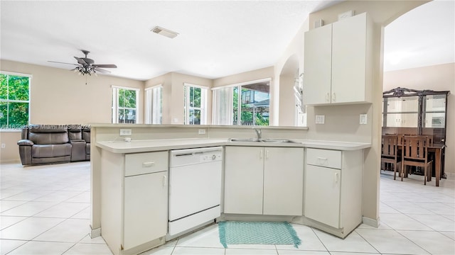 kitchen with ceiling fan, light tile patterned flooring, white dishwasher, and plenty of natural light