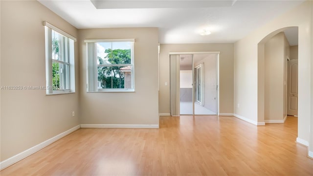 unfurnished room with light hardwood / wood-style flooring