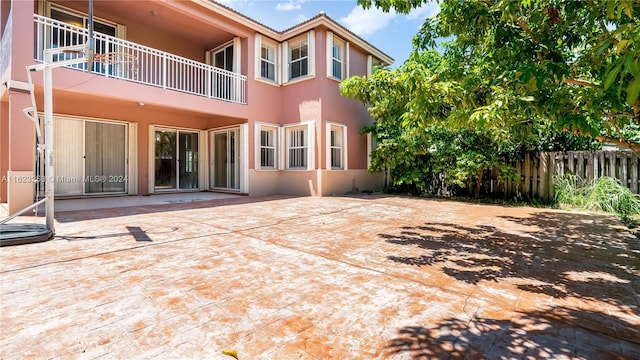 back of property with a patio area