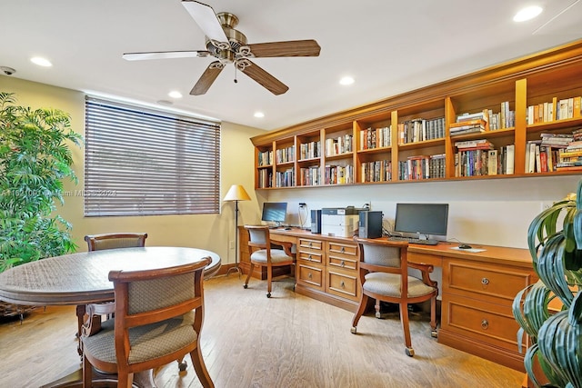 office area with light hardwood / wood-style floors and ceiling fan